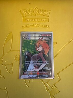 Pokémon Trainer Card - Brigette (Holo) on Yellow Pikachu Playmat